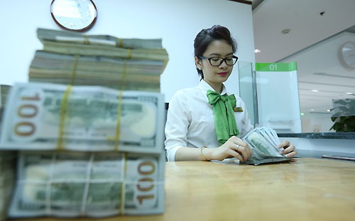 Dù đã hé cửa hơn để tạo điều kiện cho tỷ giá có vùng biến động rộng hơn, phản ánh thị trường tốt hơn, nhưng mức độ kiểm soát và định hướng của nhà điều hành vẫn thể hiện rõ - Ảnh: Quang Phúc.