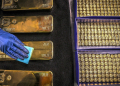 A worker polishes gold bullion bars at the ABC Refinery in Sydney on August 5, 2020. - Gold prices hit 2,000 USD an ounce on markets for the first time on August 4, the latest surge in a commodity seen as a refuge amid economic uncertainty. (Photo by DAVID GRAY / AFP) (Photo by DAVID GRAY/AFP via Getty Images)
